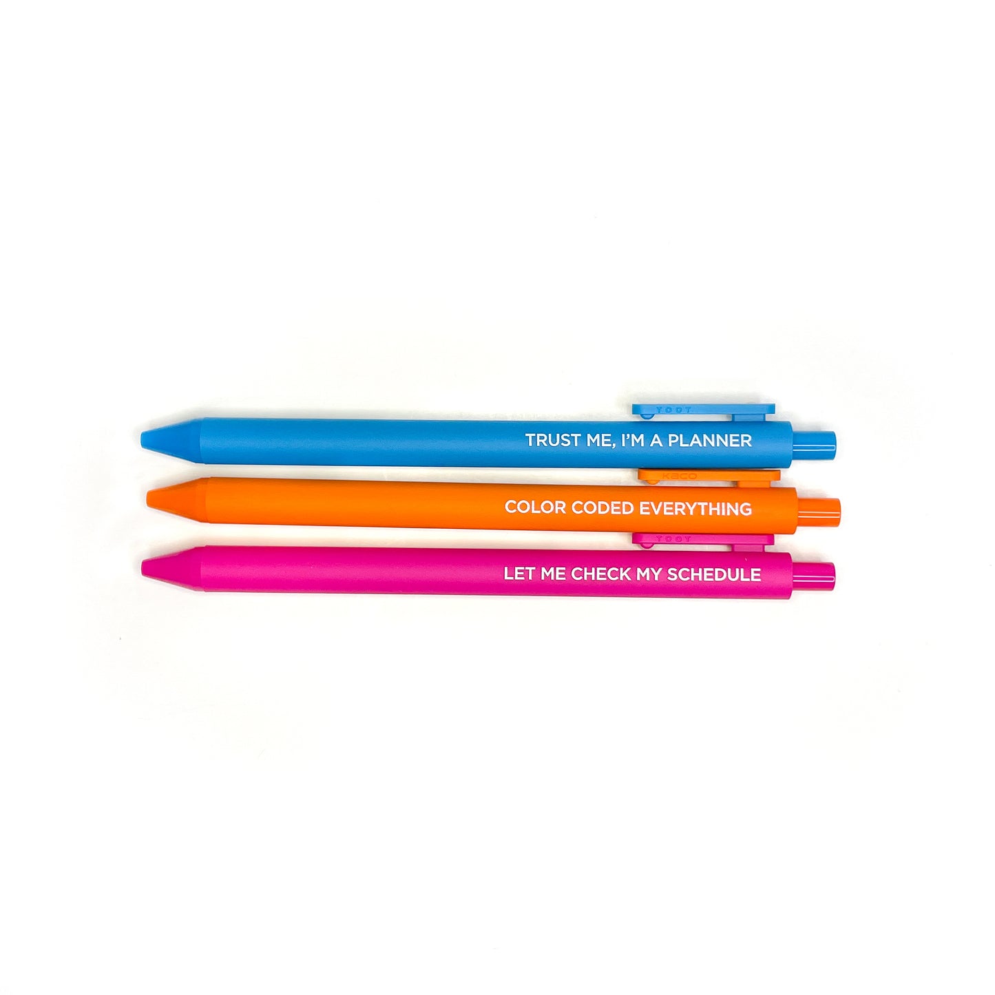 Three retractable pens with funny planner quotes in turquoise, orange, and hot pink showing full length on white background - Grey Street Paper