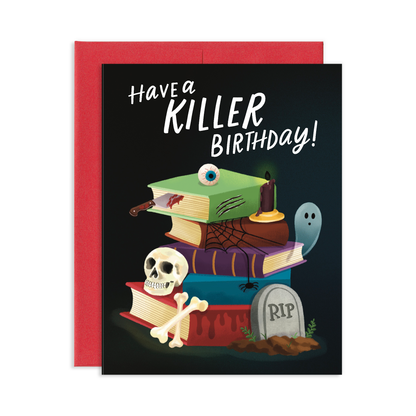 Have a Killer Birthday greeting card with stack of horror books, skull and crossbones, bloody knife, candle, ghost, eyeball, and RIP headstone on black background with red envelope