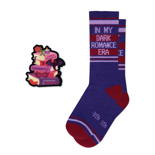 In My Romance Era Purple socks with red accents and text, paired with a decorative sticker on a white background
