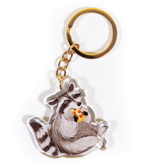 Raccoon eating pepperoni pizza acrylic keychain with gold ring showing happy trash panda holding pizza slice on white background - Grey Street Paper