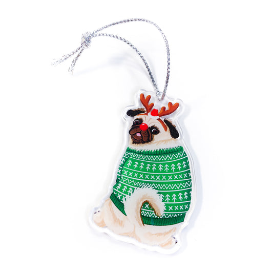 Pug dog wearing green ugly Christmas sweater with reindeer antlers clear acrylic ornament with silver string on white background