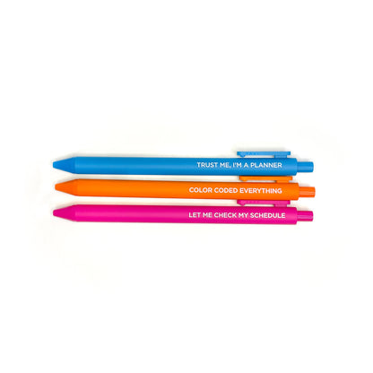 Three retractable pens with funny planner quotes in turquoise, orange, and hot pink showing full length on white background - Grey Street Paper