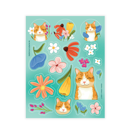 Orange cat and wildflowers sticker sheet with 18 paper stickers including tabby cats, daisies, pink flowers, blue flowers, and green leaves on turquoise background 