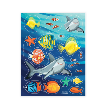 Under the sea ocean animals sticker sheet with 17 paper stickers including shark, tropical fish, clownfish, starfish, and angelfish on dark blue water background