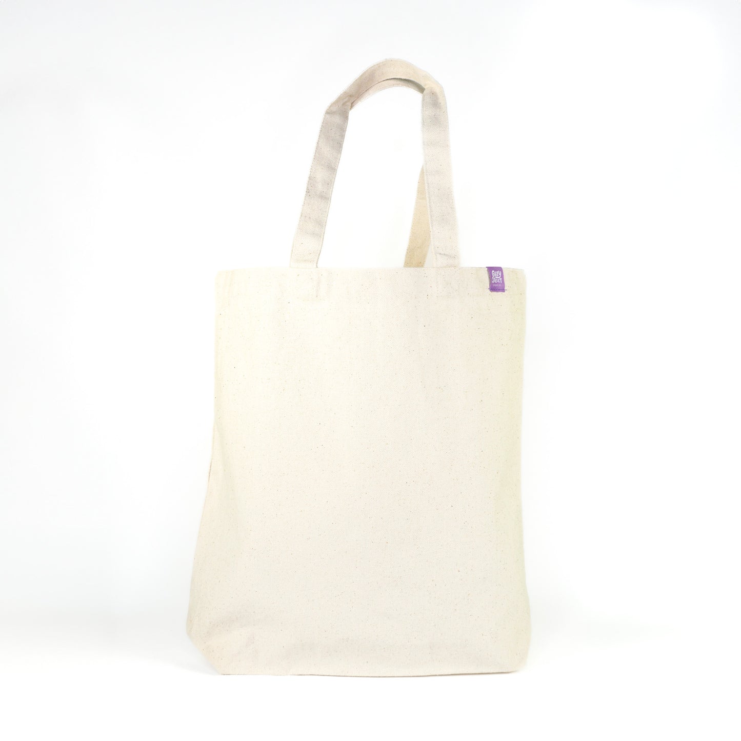 Back view of natural cream cotton tote bag with Grey Street Paper purple label tag on white background