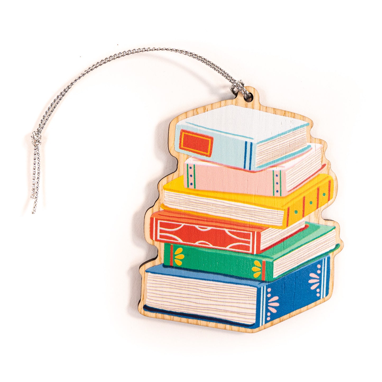 Colorful stack of books wood Christmas ornament with silver string featuring blue, pink, yellow, orange, and green hardcover books on white background