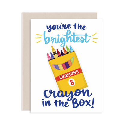 Greeting card with a yellow crayon box illustration and text You're The Brightest Crayon In The Box on a white background