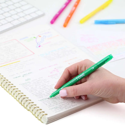 A stylized photo of a hand writing notes in a spiral notebook with Tombow Twintone Marker.