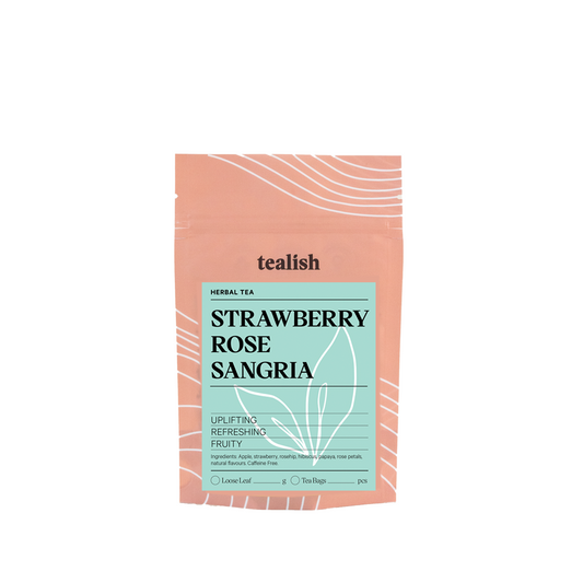 A package of Tealish Strawberry Rose Sangria Herbal Tea with a pink and light blue design, indicating the flavor profile of strawberry, rose, and hibiscus.